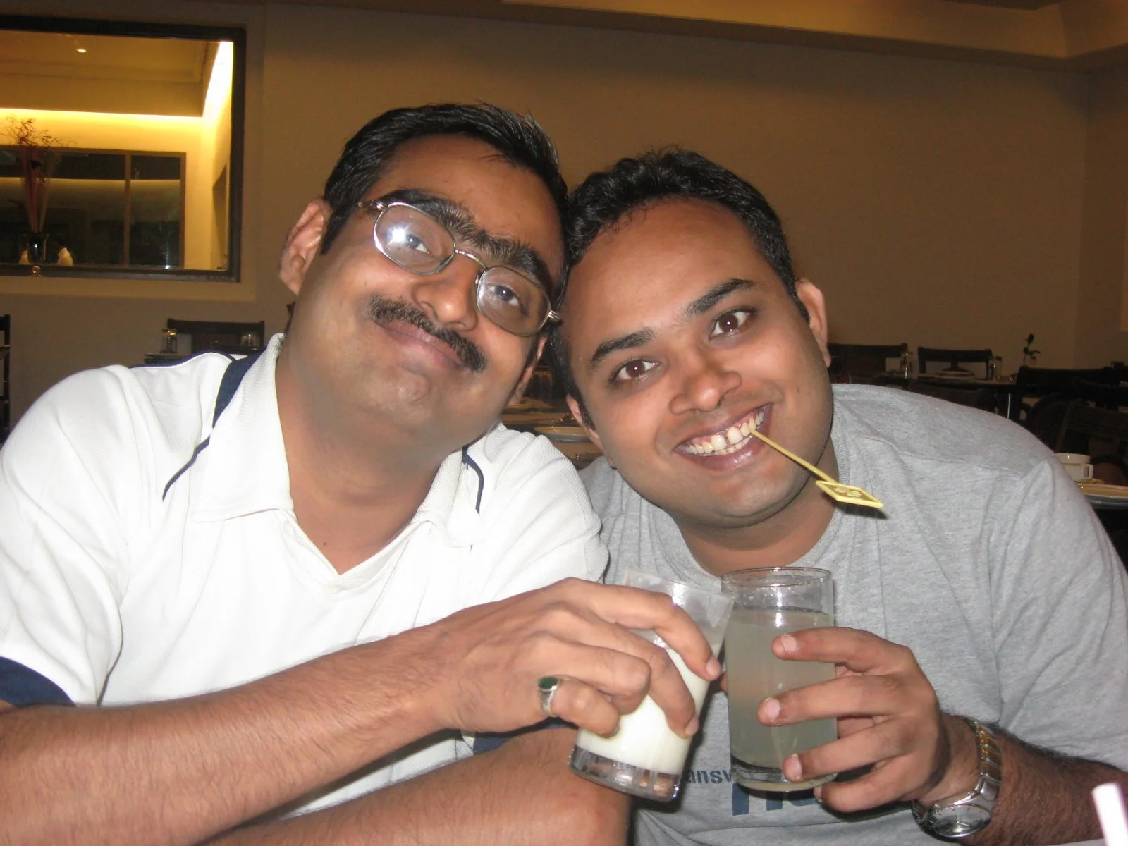 Kaka and Adi, grinning cheek to cheek over drinks